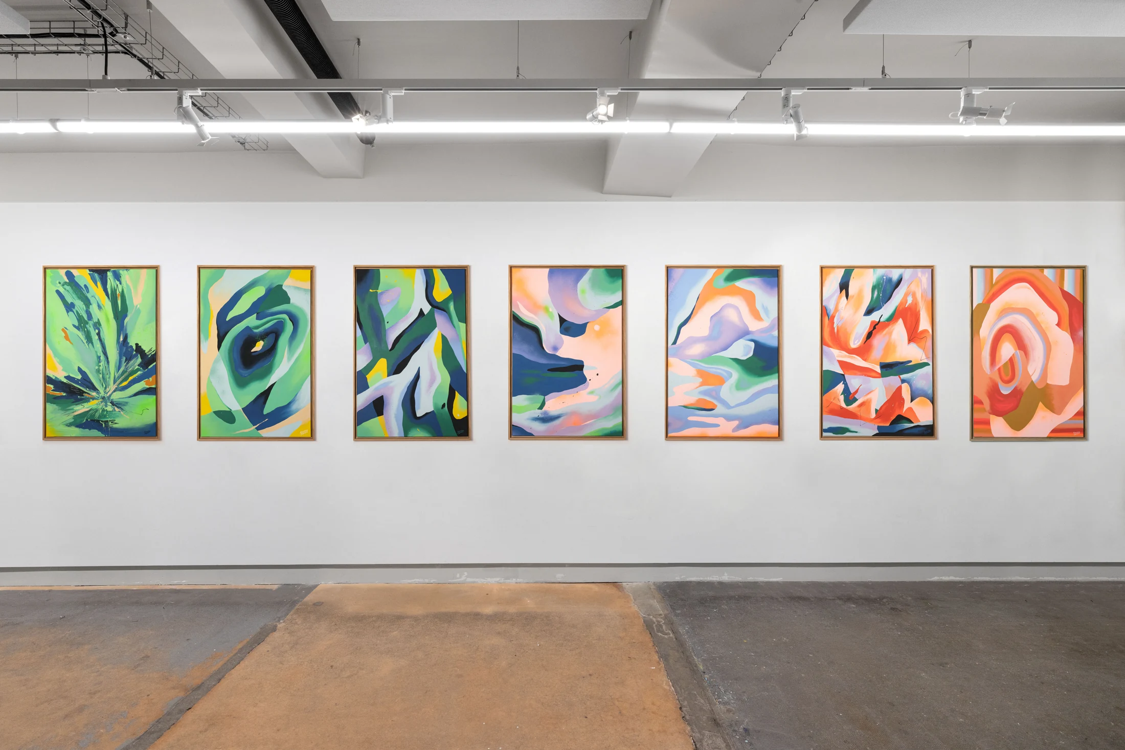 Paintings by Perrine Honoré exhibited in a gallery